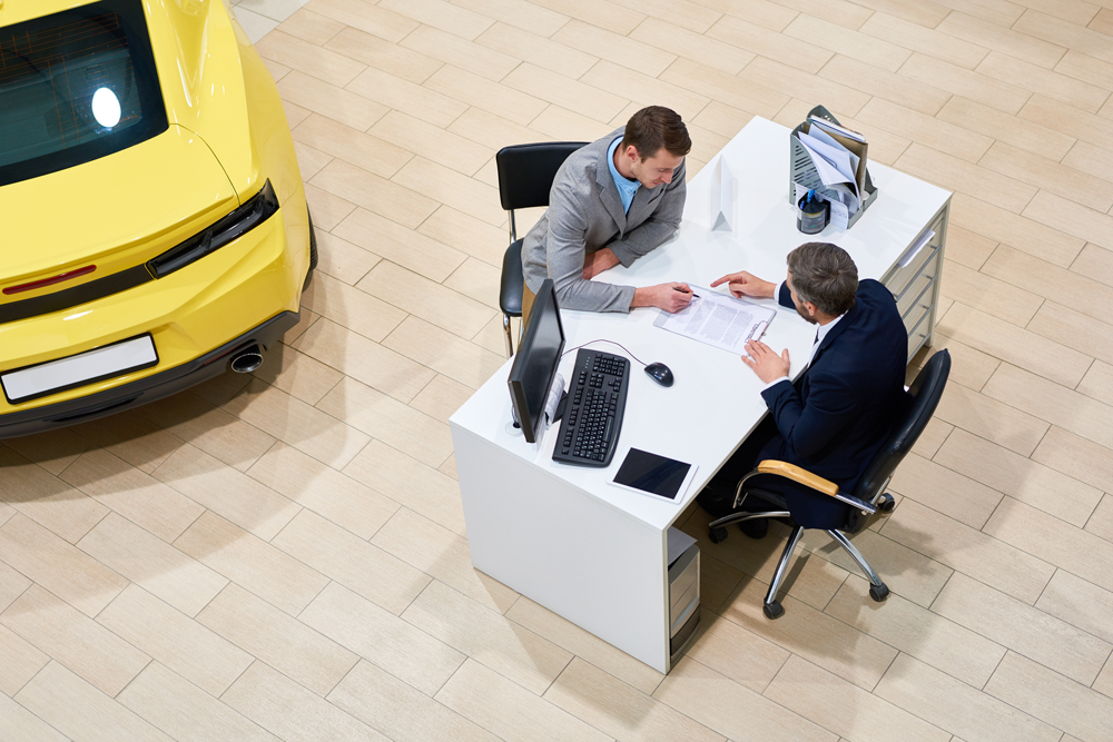 mobile_client-signing-papers-to-buy-car-2021-09-24-03-56-21-utc